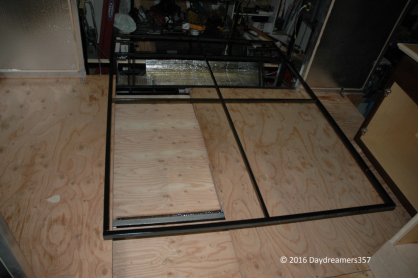 Flip-down Bed Frame built as part of trailer frame